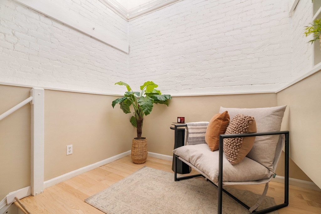 240 Heath Street, Unit PH16 Boston, MA 02130 - Photo 26 of 31 a living room with furniture flowerpot and a potted plant