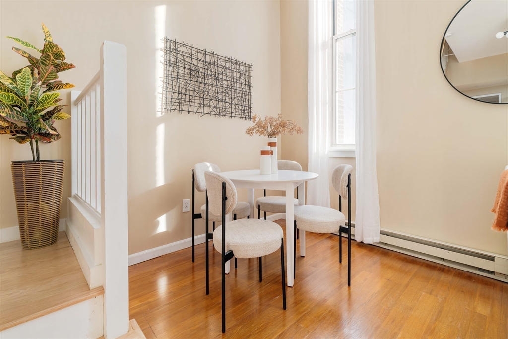 240 Heath Street, Unit PH16 Boston, MA 02130 - Photo 6 of 31 a view of a livingroom with furniture and a table in it