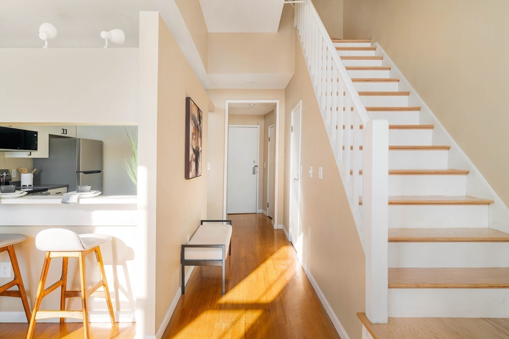 240 Heath Street, Unit PH16 Boston, MA 02130 - Photo 9 of 31 a view of a kitchen with furniture and staircase