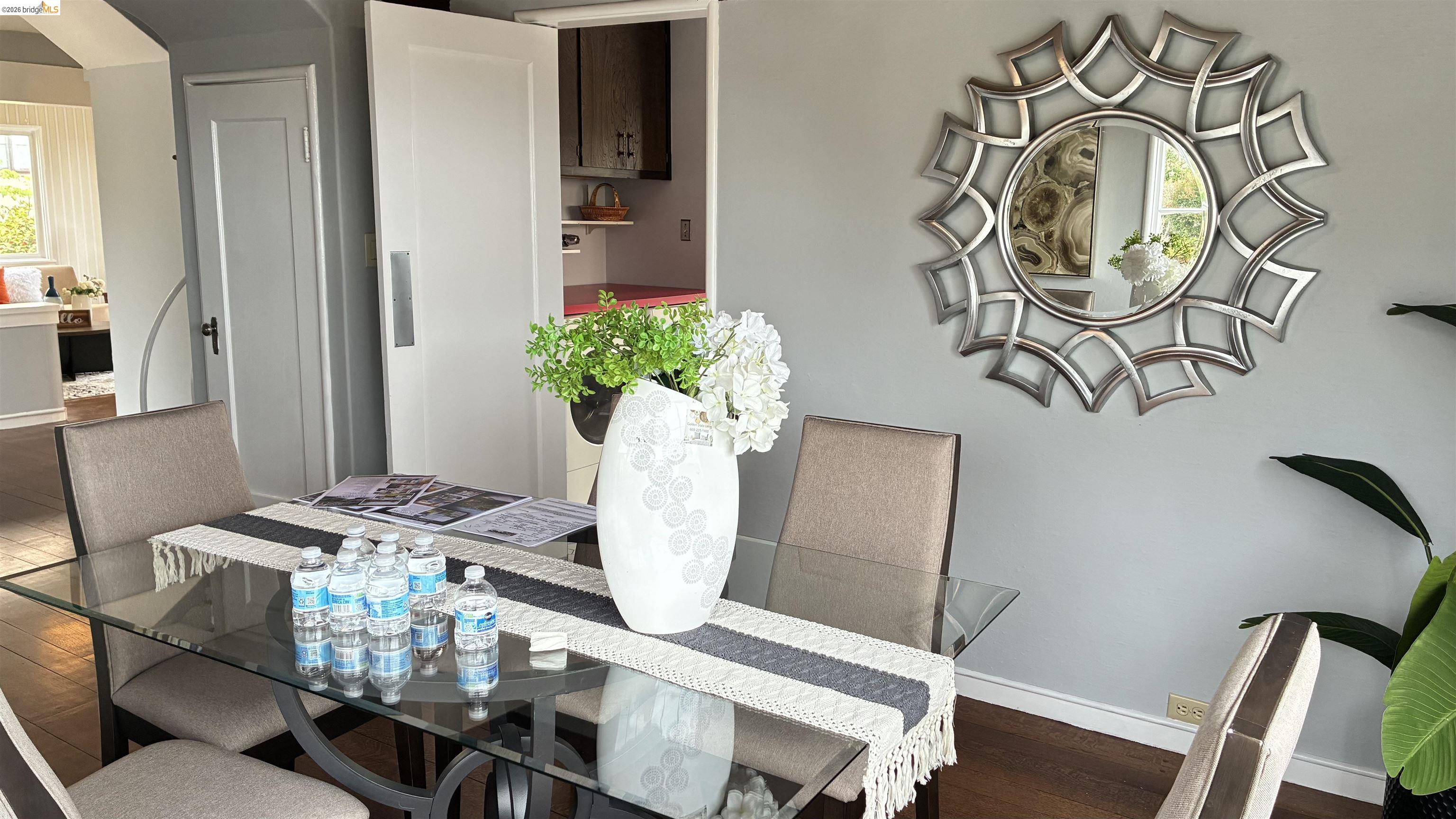 135 Alta Road Oakland, CA 94618 - Photo 15 of 42 Dining room with dark wood-style flooring and arched walkways