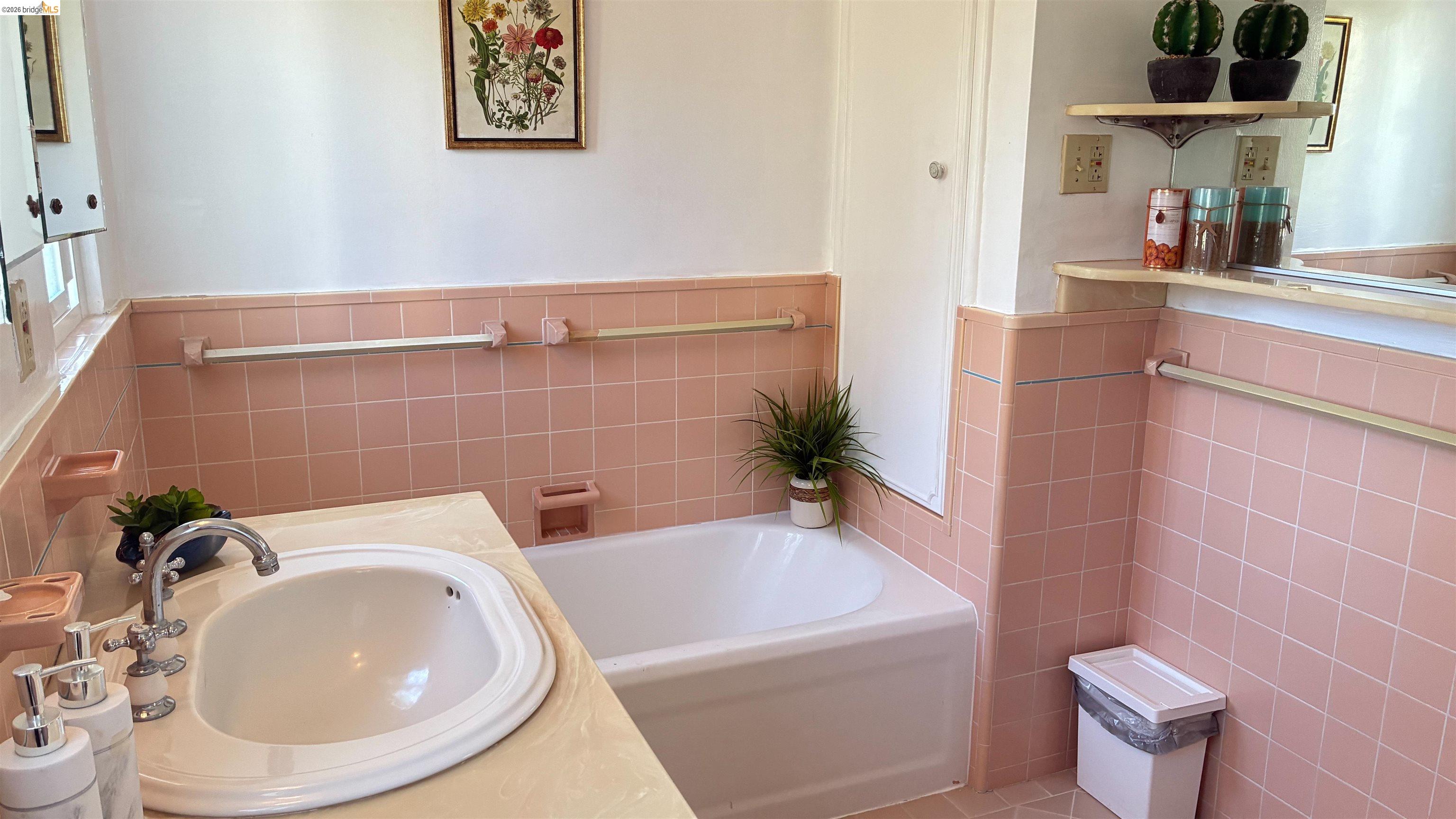 135 Alta Road Oakland, CA 94618 - Photo 38 of 42 Full bath featuring tile walls, a bath, a wainscoted wall, and vanity upstairs