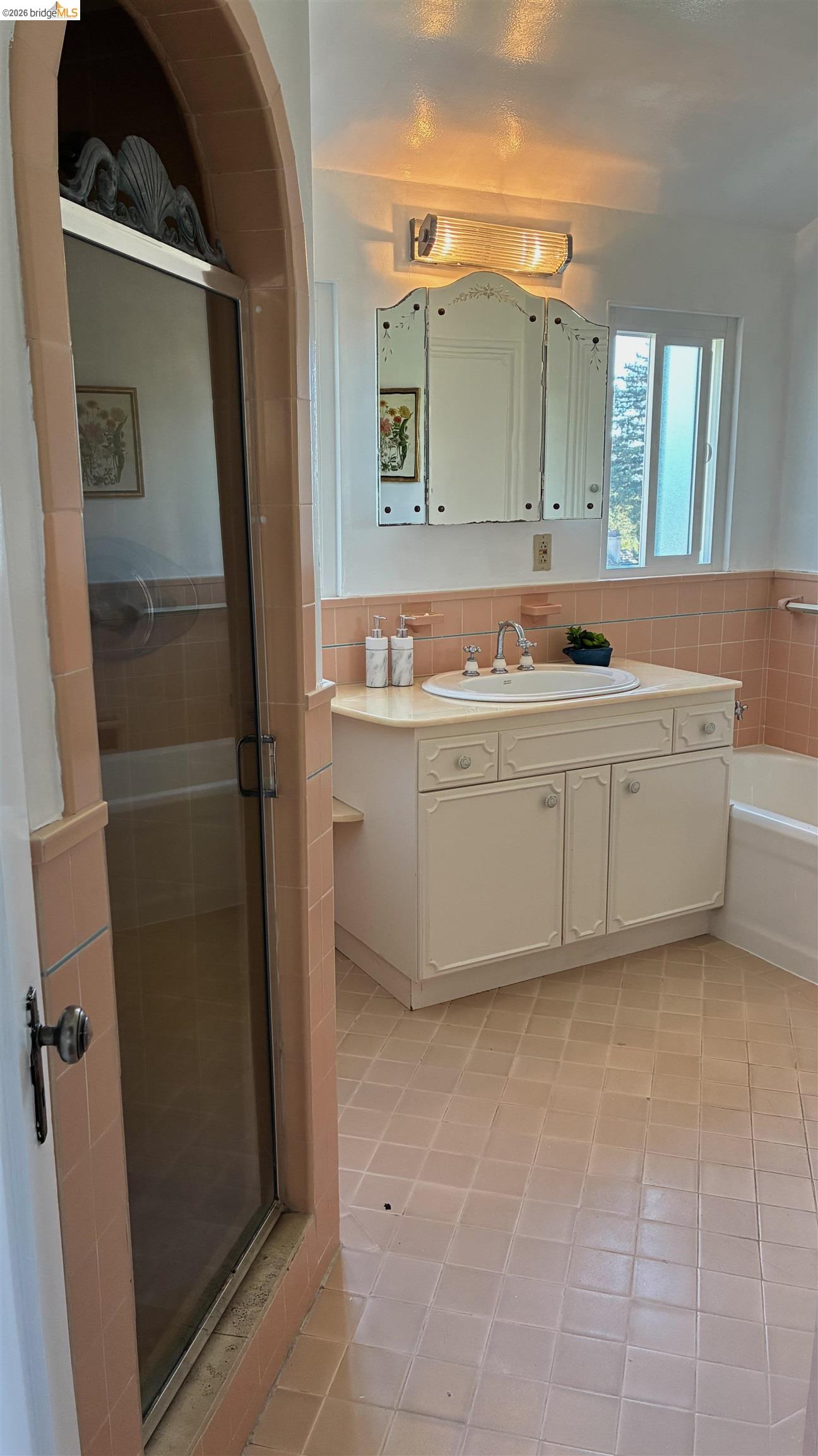 135 Alta Road Oakland, CA 94618 - Photo 39 of 42 Bathroom with a shower stall, vanity, light tile patterned floors, and tile walls