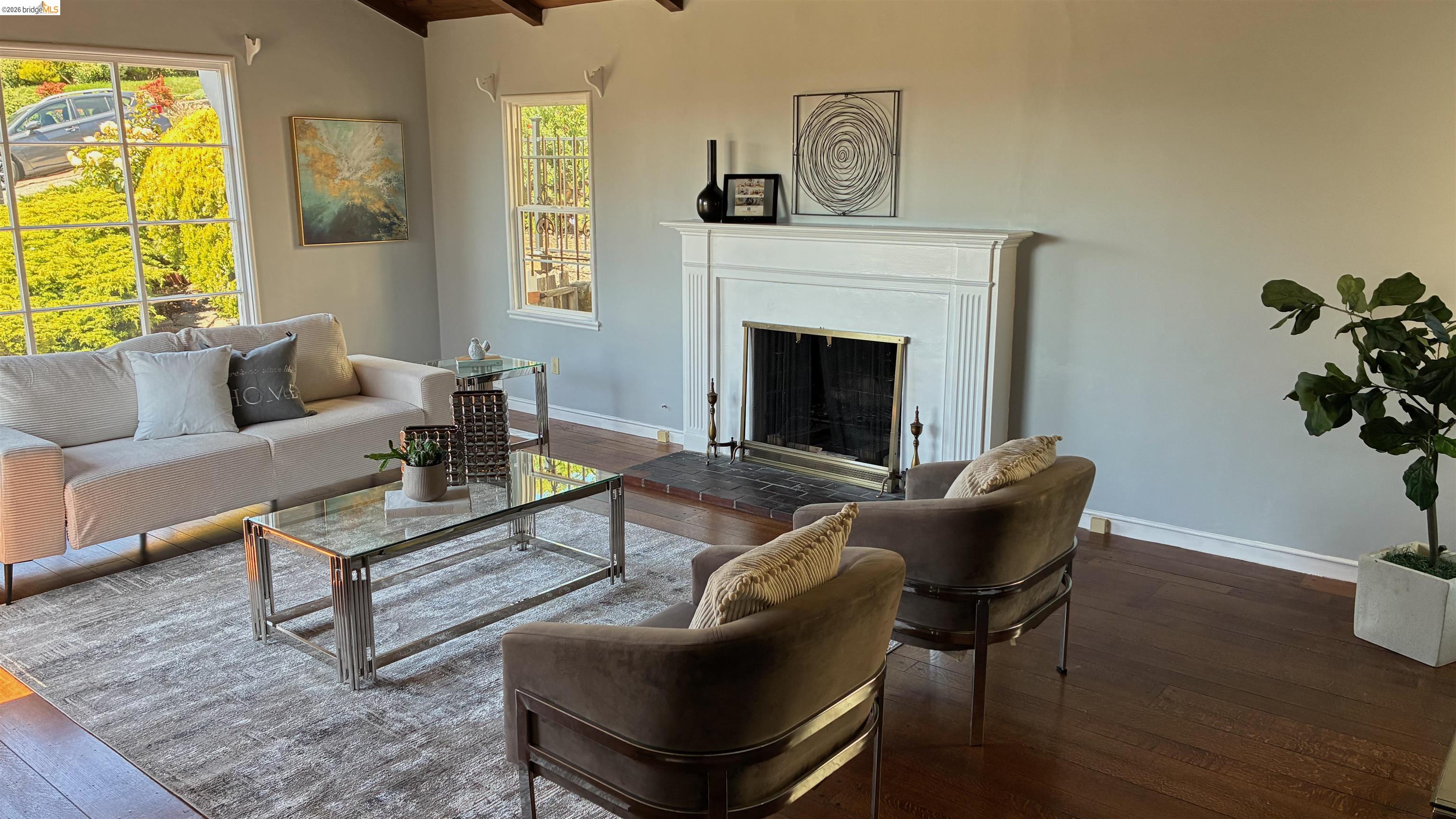 135 Alta Road Oakland, CA 94618 - Photo 6 of 42 Living room featuring a fireplace with raised hearth, hardwood / wood-style floors, and wood ceiling