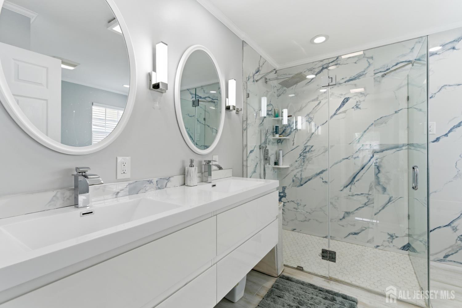 26 Alexis Lane Edison, NJ 08820 - Photo 21 of 39 a bathroom with a sink mirror and a shower