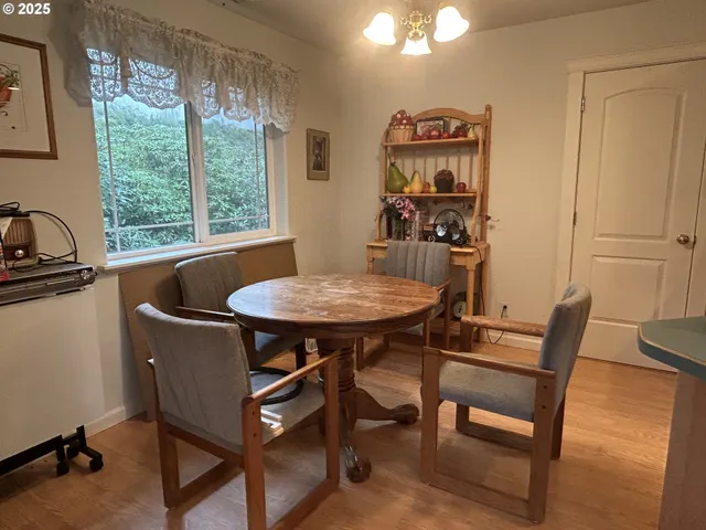 a view of a dining room with furniture window and outside view