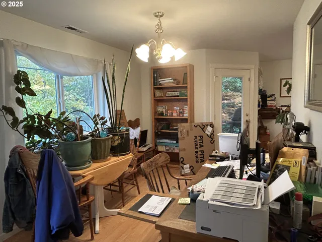 a view of a dining room with furniture window and outside view