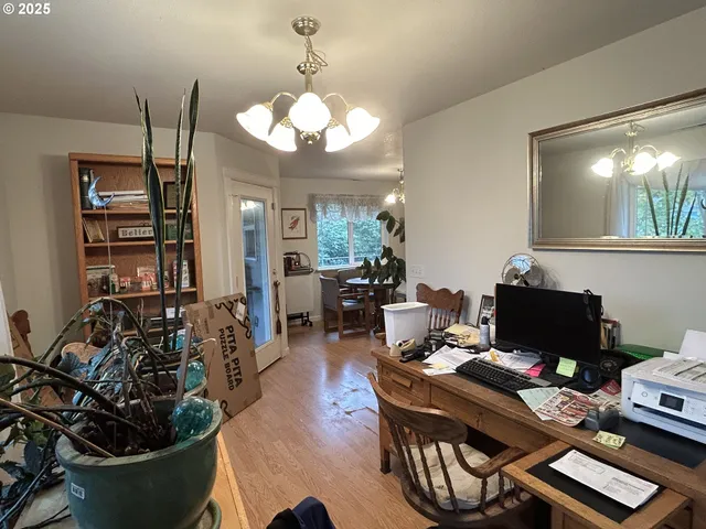 a living room with lots of furniture and a chandelier