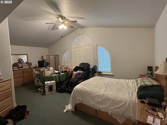 a bed room with bed and window