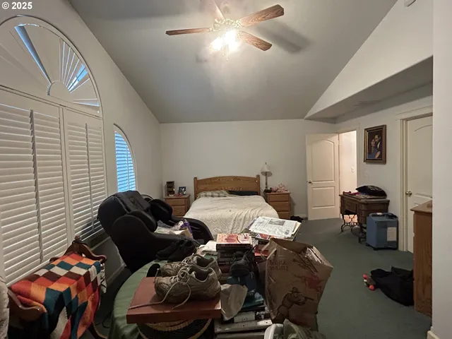 a bedroom with furniture and a window