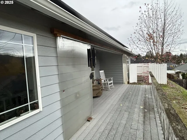 a view of outdoor space with wooden floor and seating space