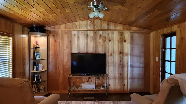 a bathroom with a shower and a mirror