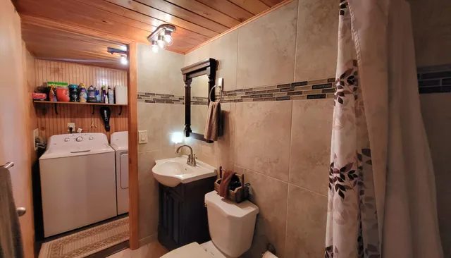 a bed room with a bed and a chair