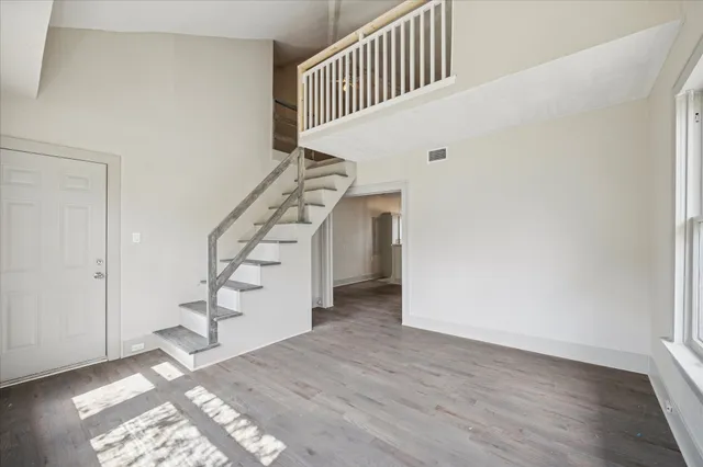a view of entryway with wooden floor