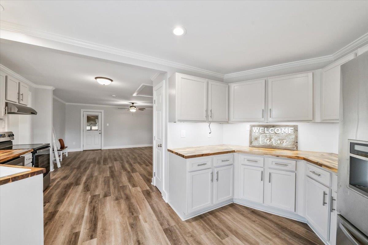 145 Quail Road Covington, TN 38019 - Photo 15 of 33 a kitchen with a sink window and cabinets