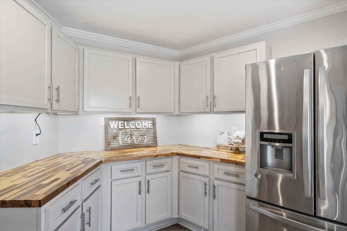 145 Quail Road Covington, TN 38019 - Photo 16 of 33 a kitchen with a sink and refrigerator