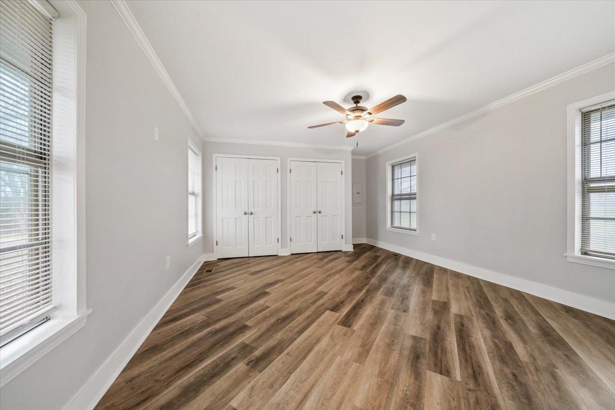 145 Quail Road Covington, TN 38019 - Photo 19 of 33 wooden floor in an empty room with a window