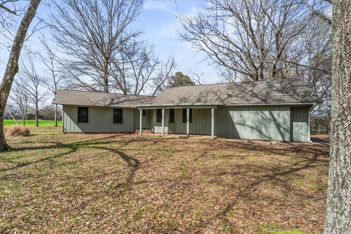 145 Quail Road Covington, TN 38019 - Photo 2 of 33 a view of a house with a yard and large tree