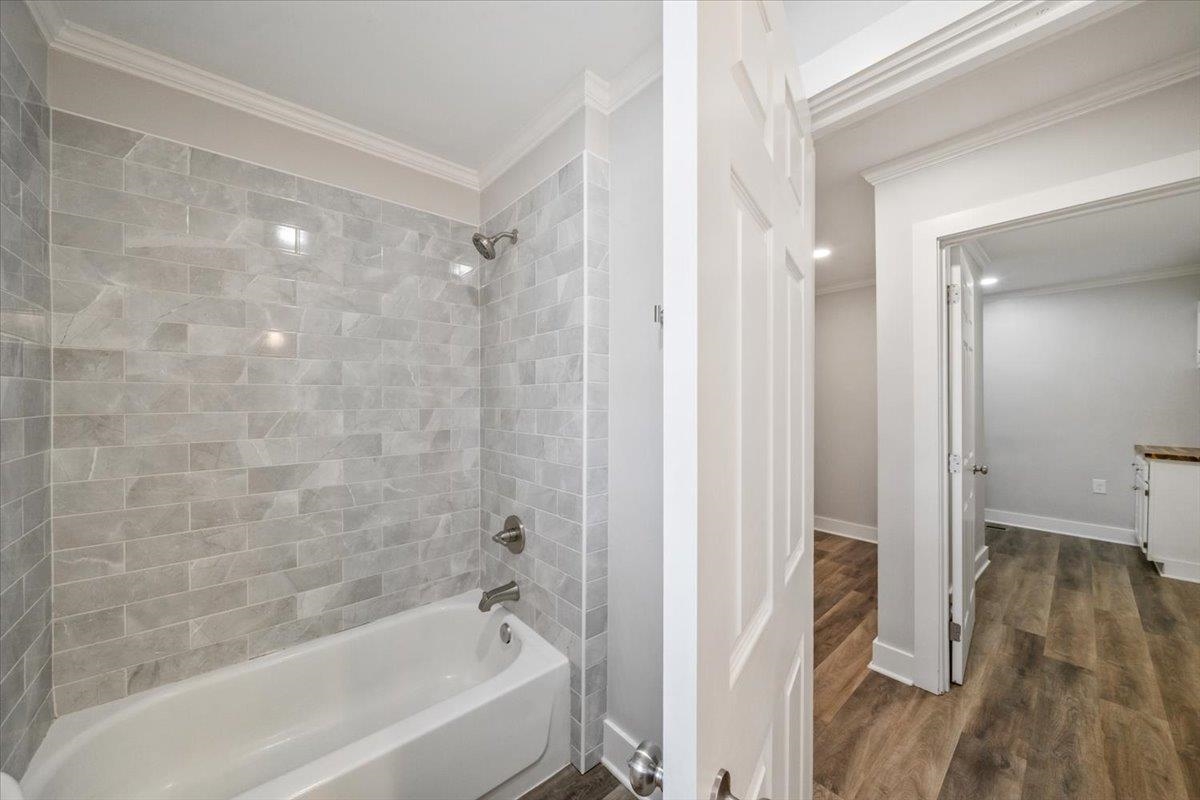 145 Quail Road Covington, TN 38019 - Photo 24 of 33 a bathroom with a bathtub and a shower