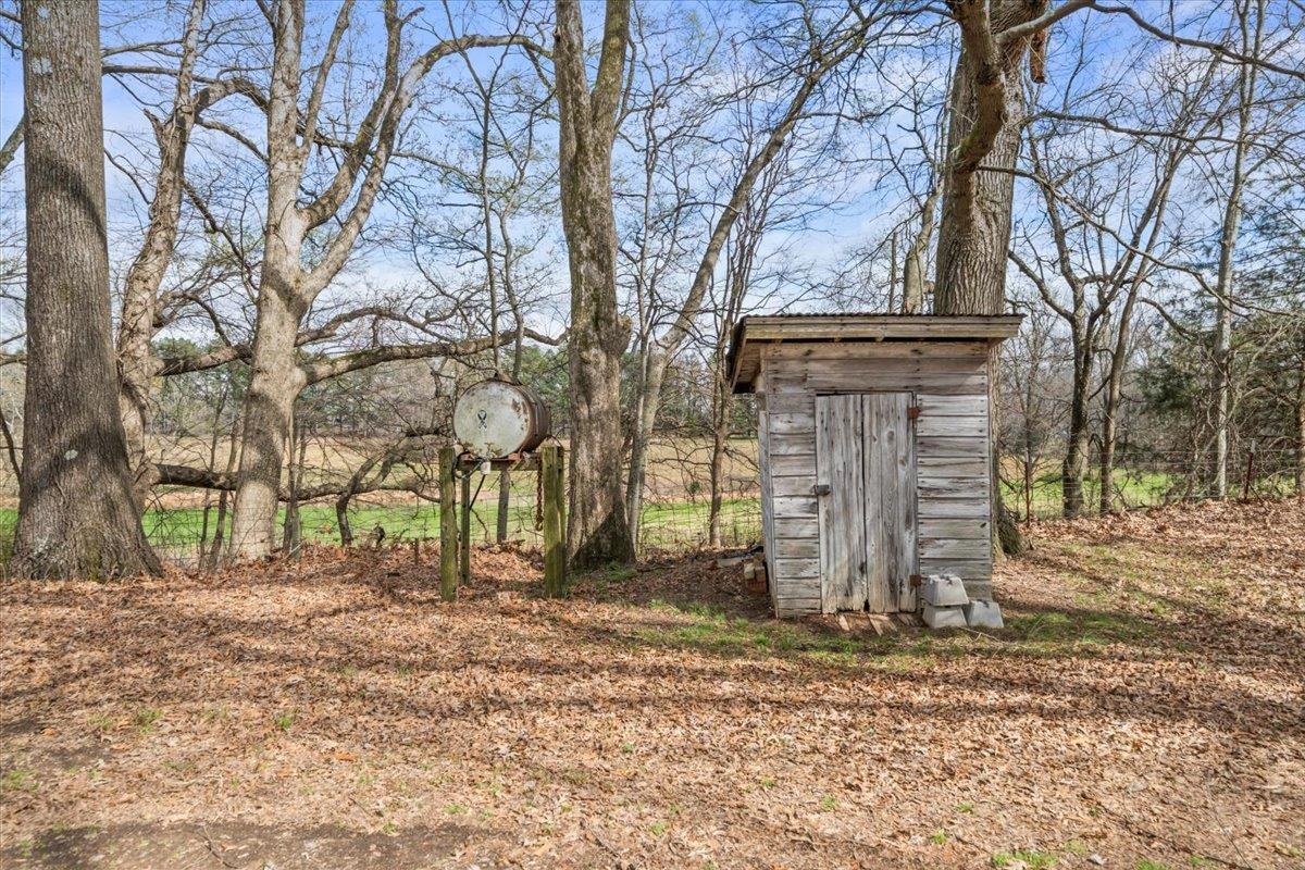 145 Quail Road Covington, TN 38019 - Photo 28 of 33 a backyard of a house with lots of green space