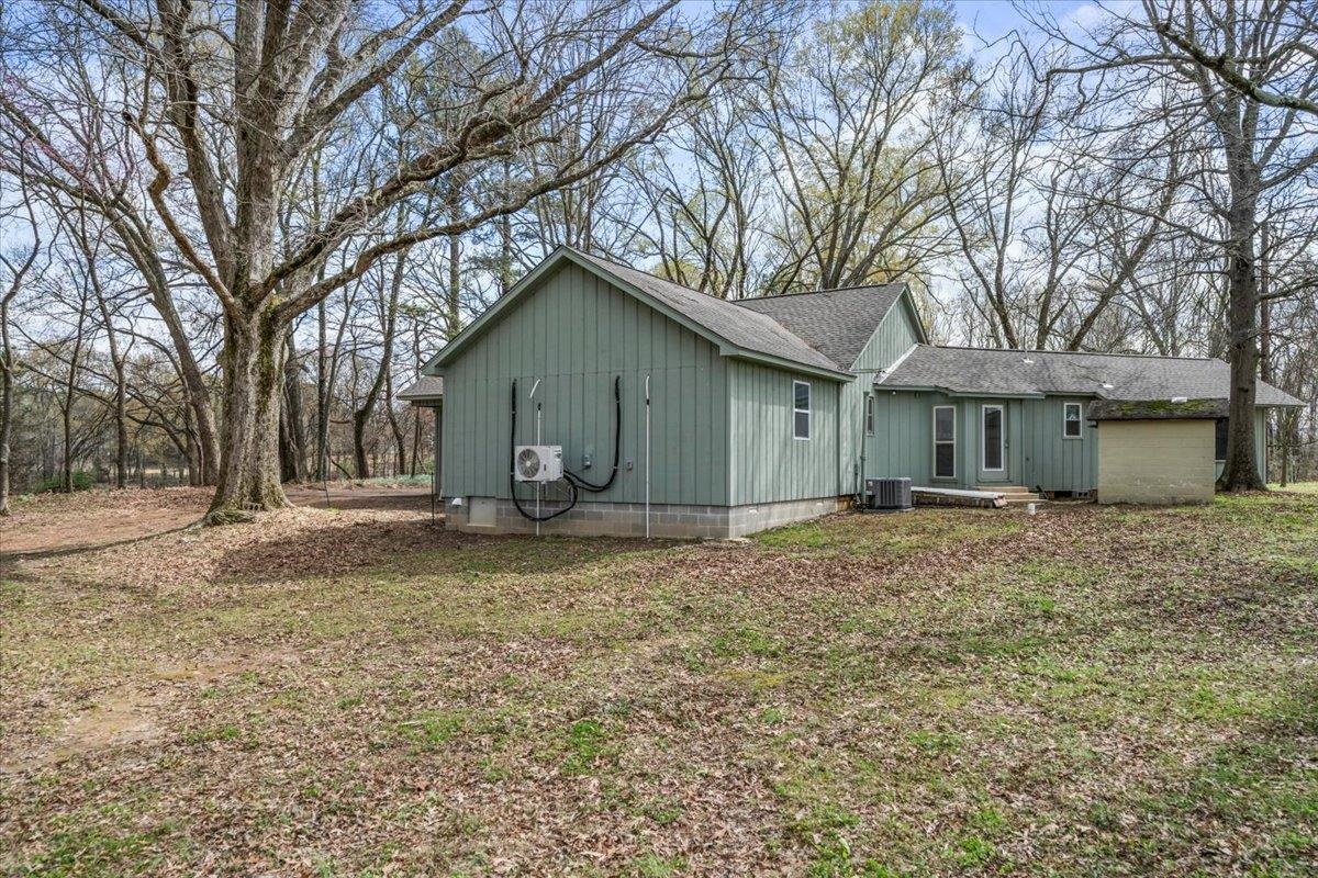 145 Quail Road Covington, TN 38019 - Photo 31 of 33 a view of a house with a yard and large tree