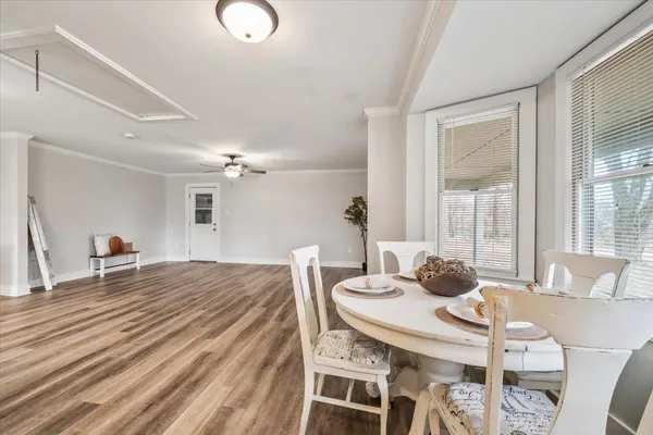 a dining room with furniture and window