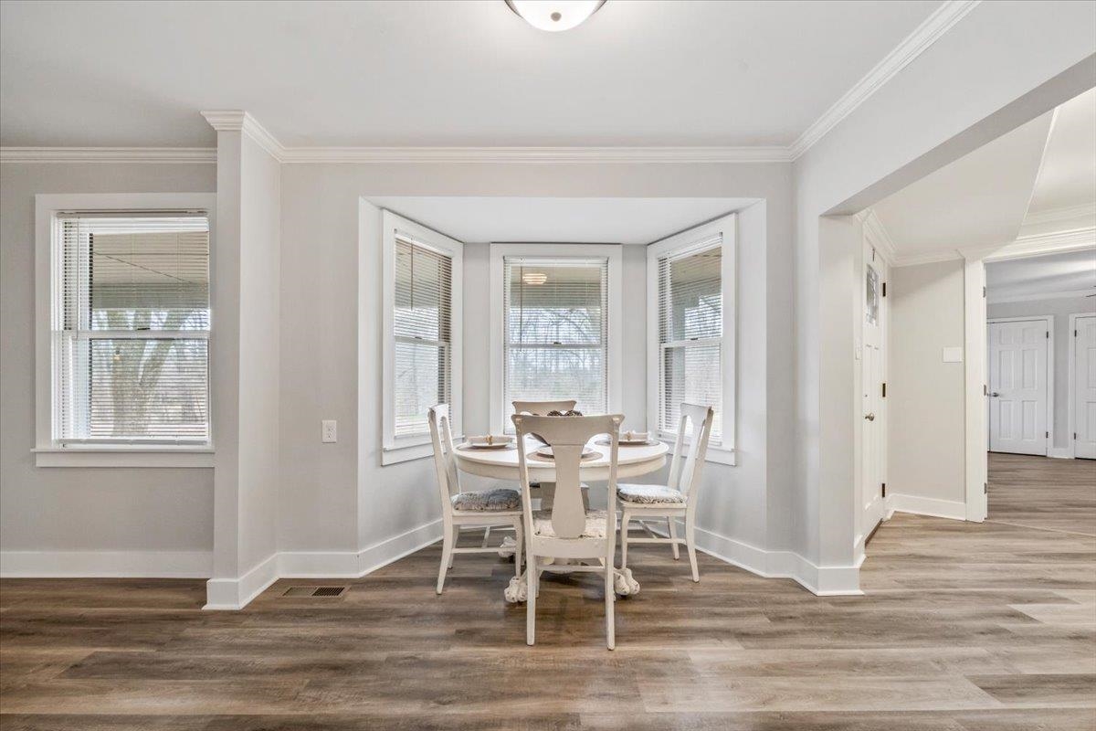 145 Quail Road Covington, TN 38019 - Photo 9 of 33 a view of a dining room with furniture window and wooden floor