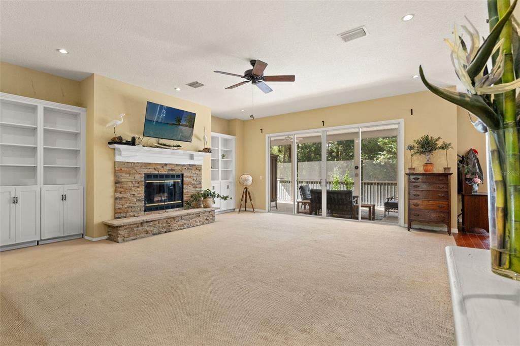 4270 Southeast 193rd Place Yankeetown, FL 34498 - Photo 12 of 42 a view of an empty room with a fireplace and a window