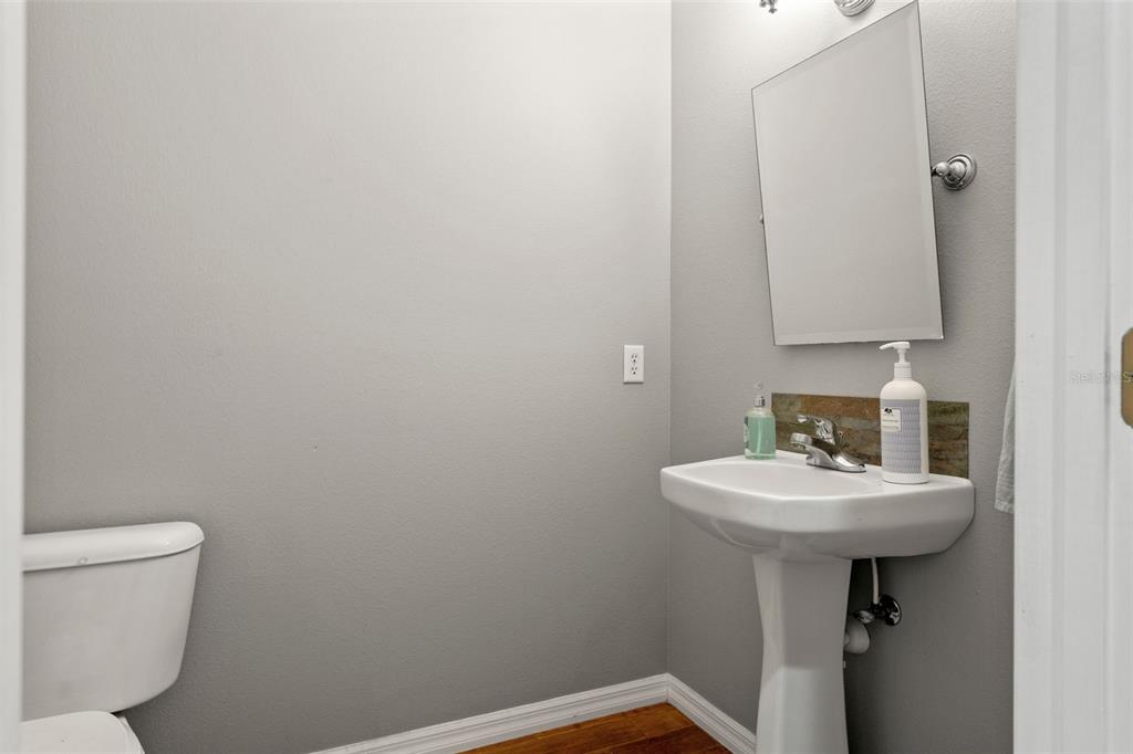 4270 Southeast 193rd Place Yankeetown, FL 34498 - Photo 21 of 42 a bathroom with a sink a toilet and mirror