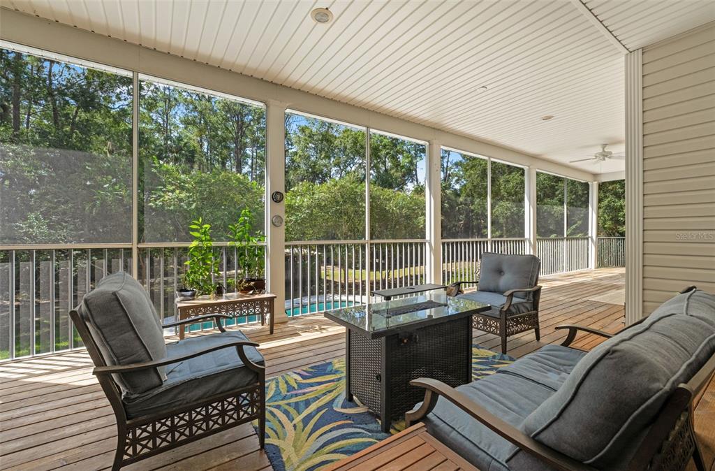 4270 Southeast 193rd Place Yankeetown, FL 34498 - Photo 24 of 42 a balcony with wooden floor and furniture
