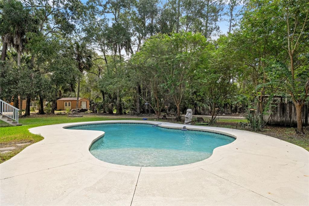 4270 Southeast 193rd Place Yankeetown, FL 34498 - Photo 26 of 42 a view of a swimming pool with outdoor seating