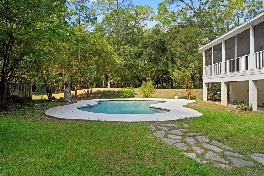 4270 Southeast 193rd Place Yankeetown, FL 34498 - Photo 27 of 42 a view of a house with a yard and basketball court