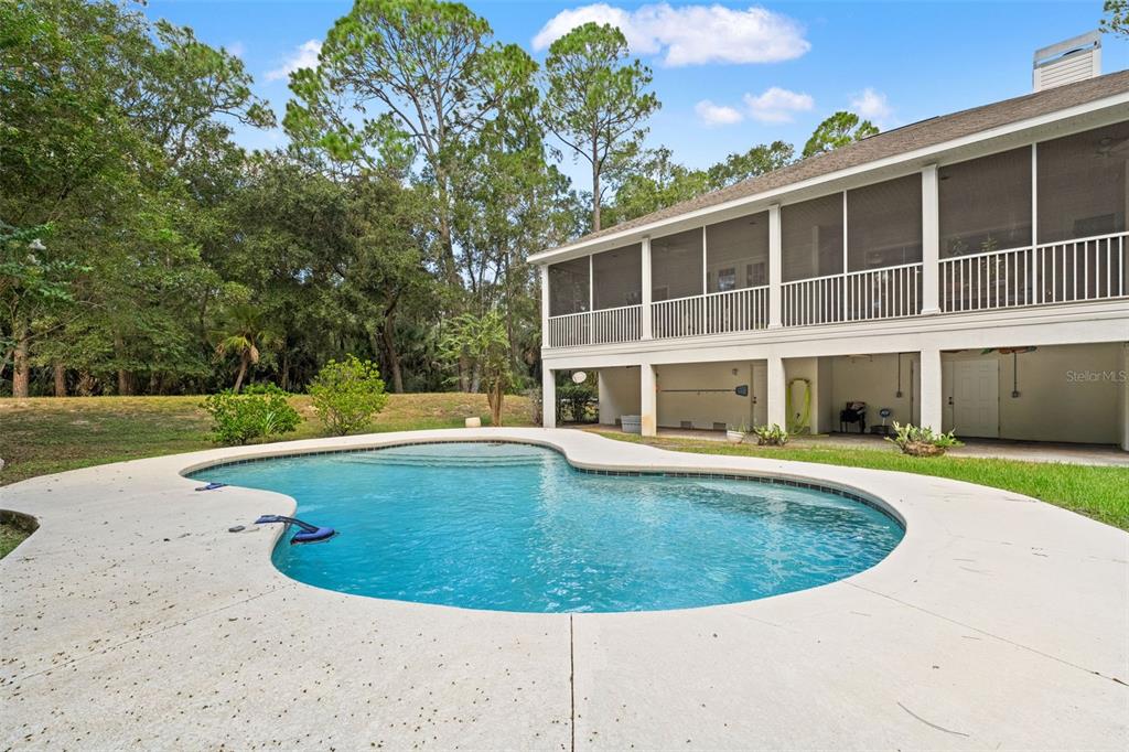 4270 Southeast 193rd Place Yankeetown, FL 34498 - Photo 29 of 42 a view of a swimming pool with a garden