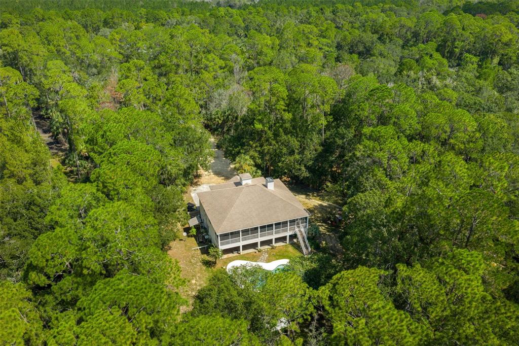 4270 Southeast 193rd Place Yankeetown, FL 34498 - Photo 37 of 42 an aerial view of a house with a yard