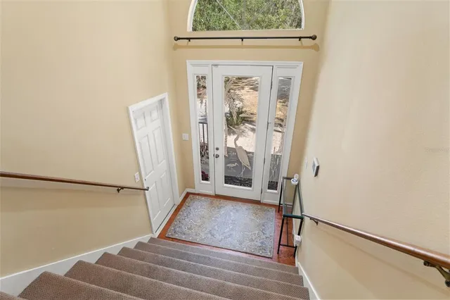 a view of front door with wooden floor