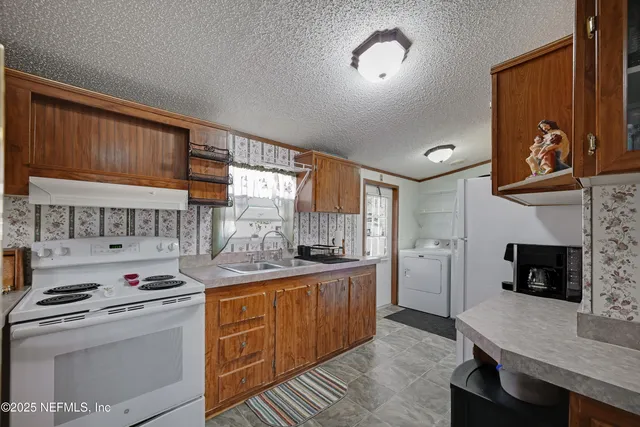 a kitchen with a stove and a refrigerator