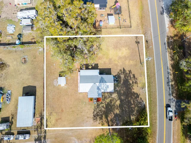 an aerial view of residential house with outdoor space
