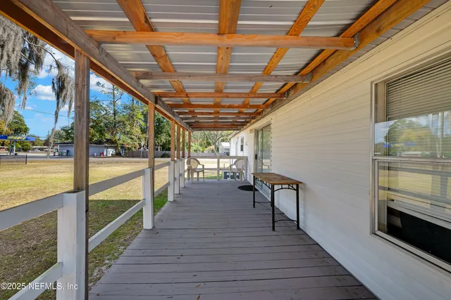 a view of a balcony with wooden floor