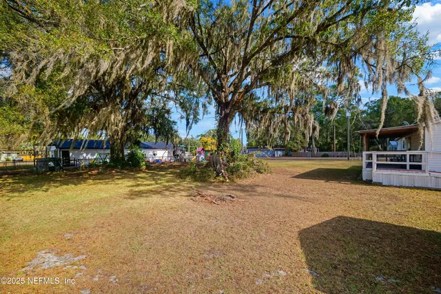 a view of a swimming pool with an outdoor seating