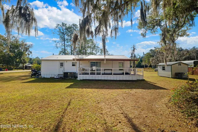 a front view of house with yard and seating area