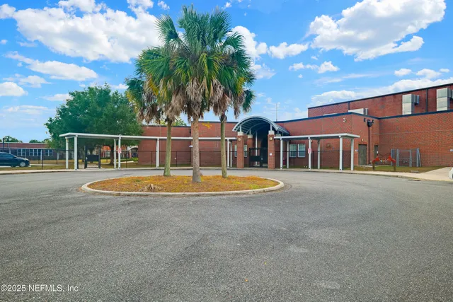 a view of a swimming pool with a lawn chairs