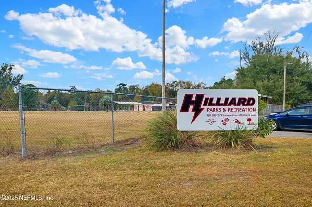 a sign board with ocean view