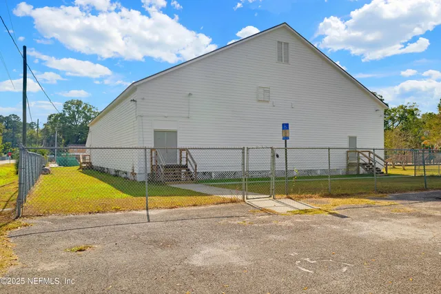 a view of a backyard with swimming pool