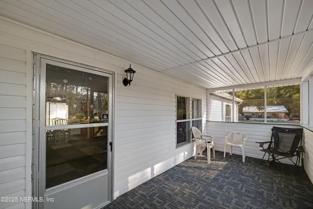 a patio with table and chairs