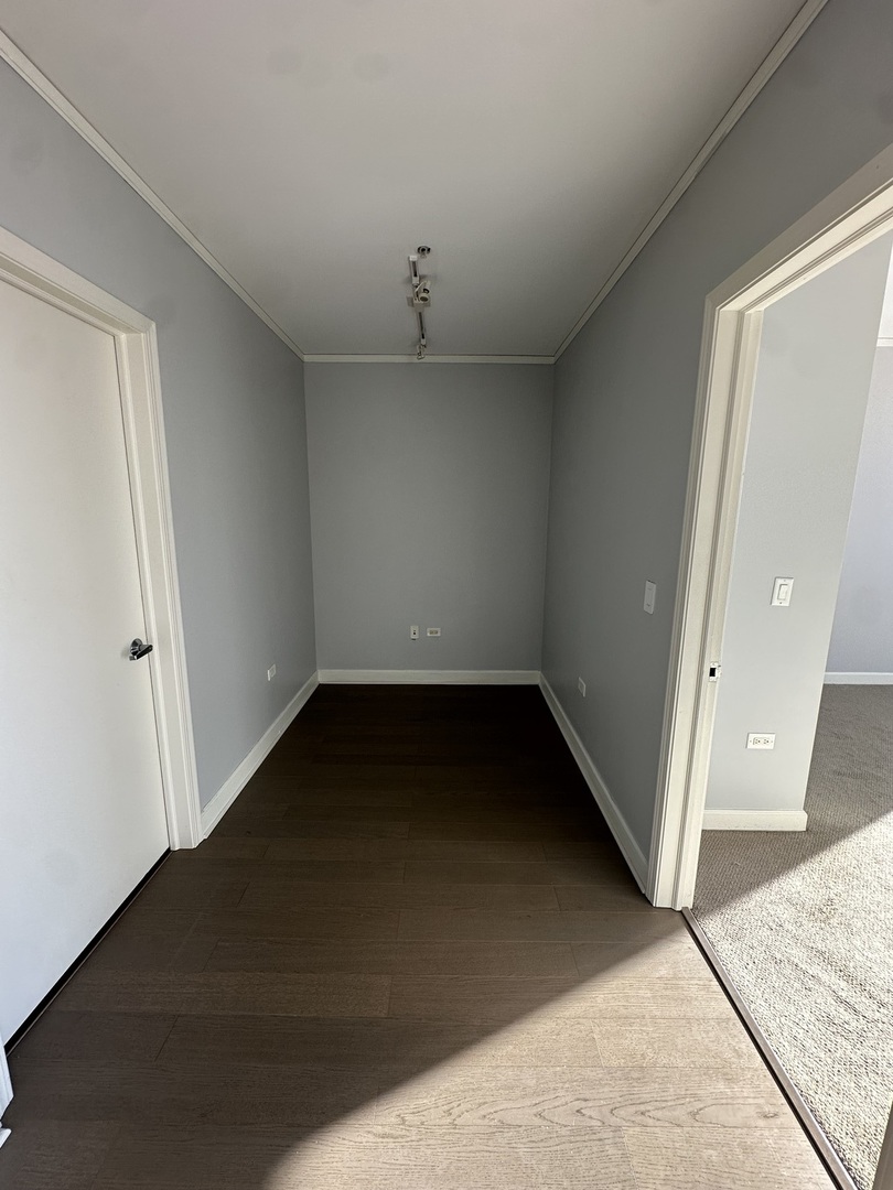 1901 South Calumet Avenue, Unit 2912 Chicago, IL 60616 - Photo 17 of 32 an empty room with a door