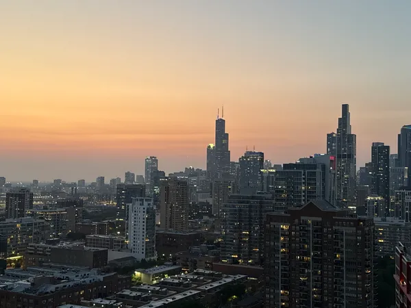 a view of a city with tall buildings