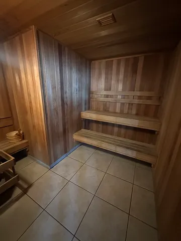 a view of a utility room with racks on the wall