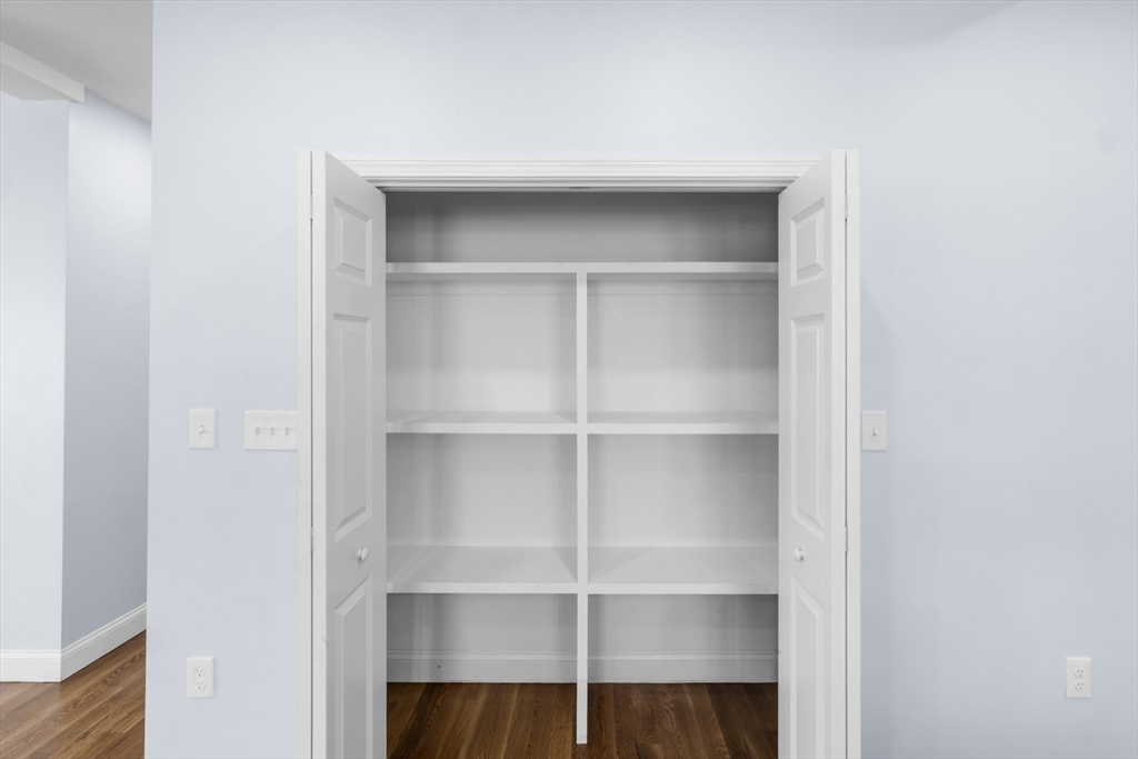 489 Spring Street Fall River, MA 02721 - Photo 12 of 42 a view of an empty walk in closet with empty racks