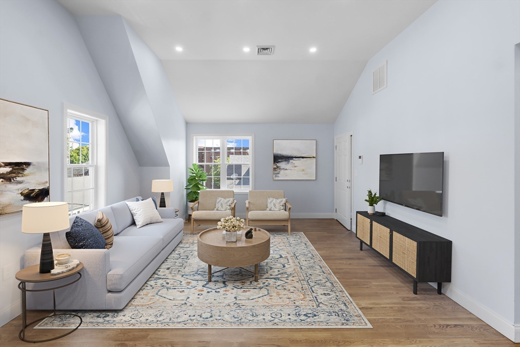 489 Spring Street Fall River, MA 02721 - Photo 21 of 42 a living room with furniture and a flat screen tv