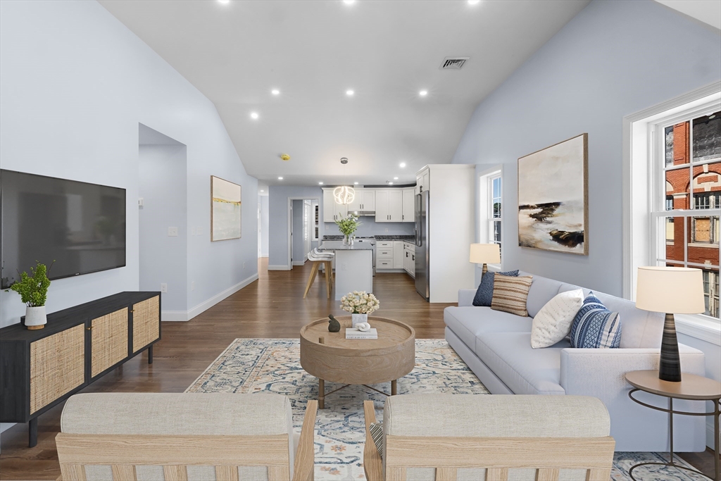 489 Spring Street Fall River, MA 02721 - Photo 22 of 42 a living room with furniture and a flat screen tv