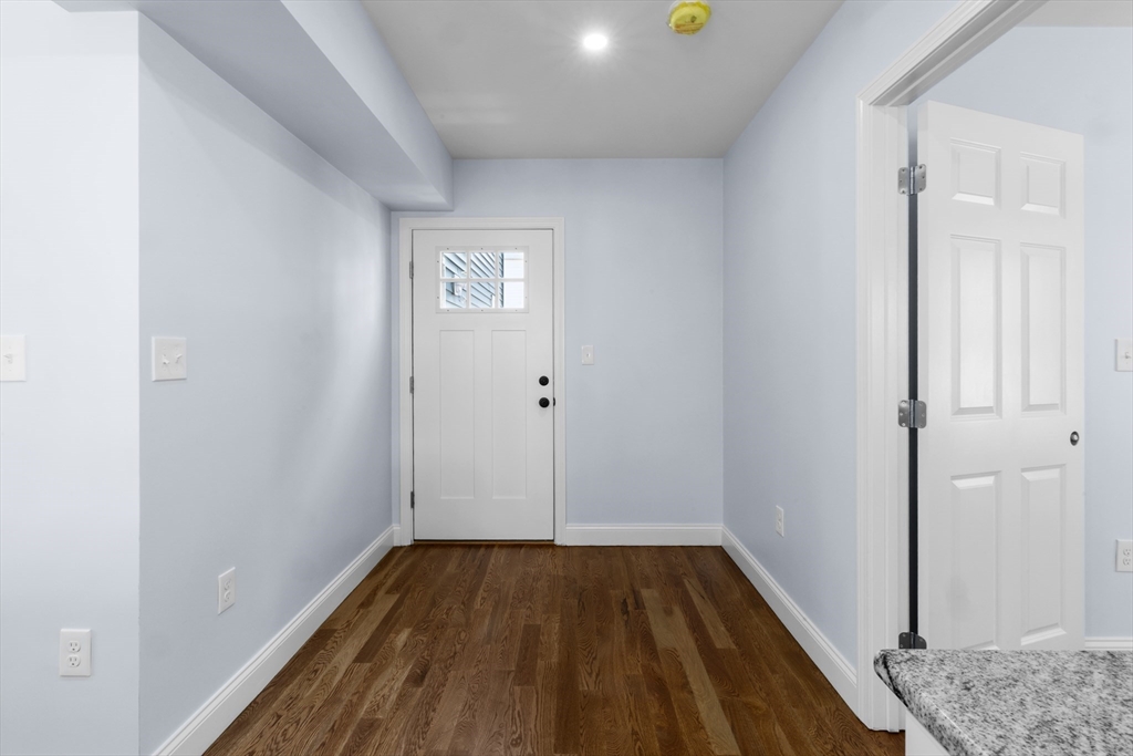 489 Spring Street Fall River, MA 02721 - Photo 27 of 42 wooden floor in an empty room